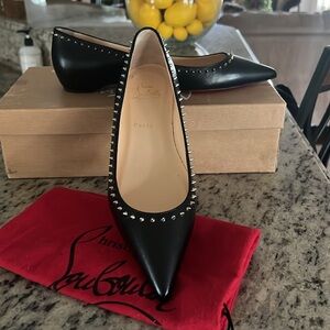 NIB Christian Louboutin Black and Silver flats with Signature Red Soles